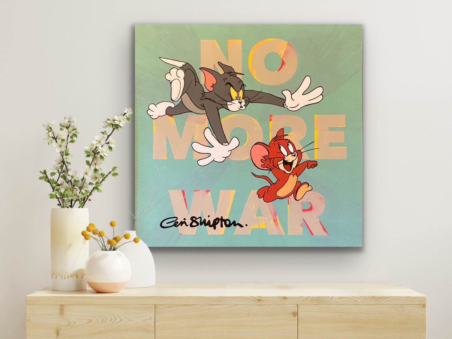 A picture of the painting "No more war" on a white wall.
