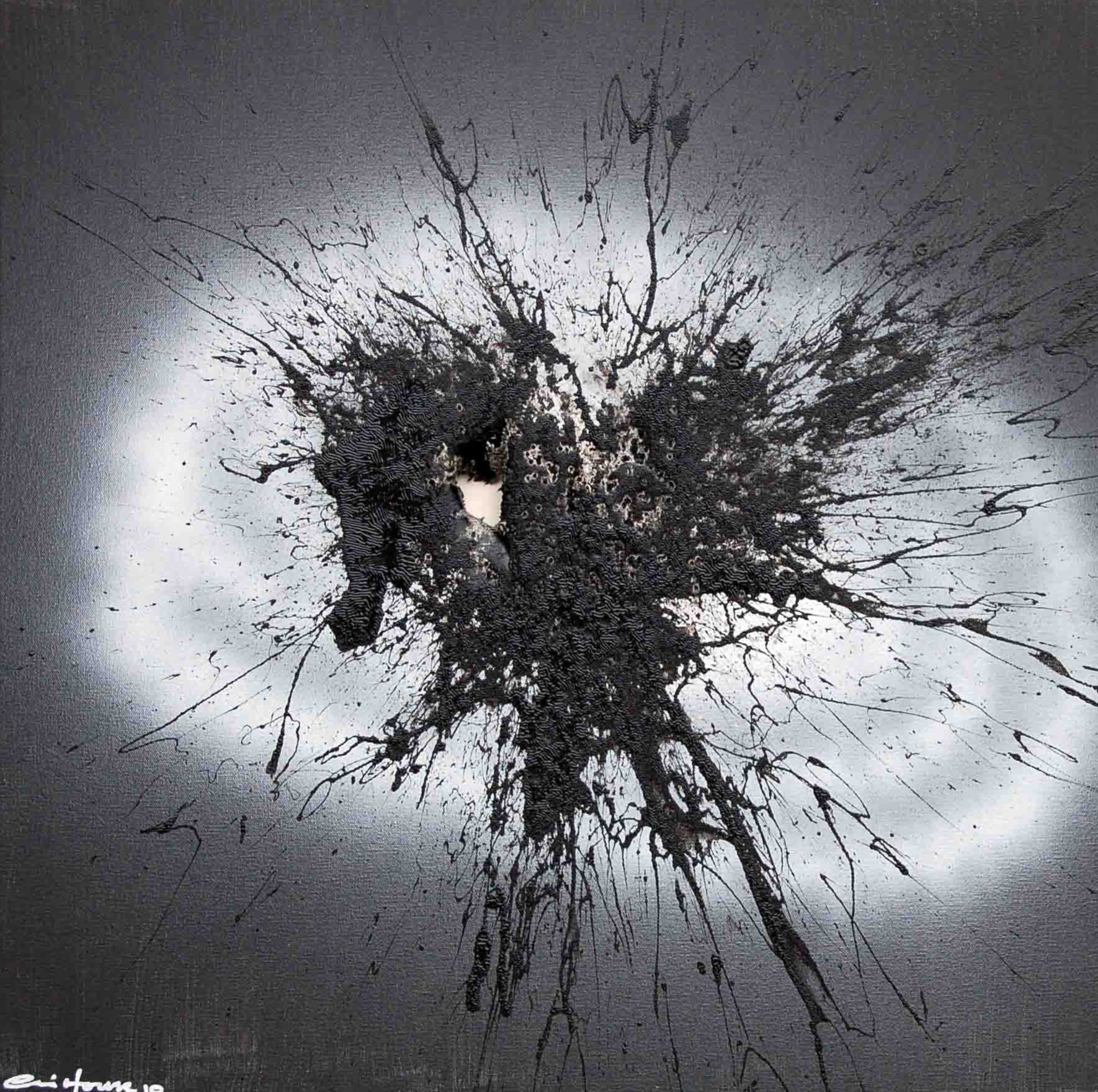 A black mark made with a shogun on a grey and white background.